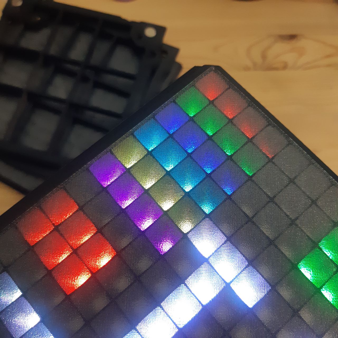 Display panel attempt with gray translucent PETG followed by black PETG on a textured PEI bed plate